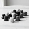 Nespresso compatible coffee pods in minimalist monochrome packaging